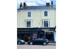 3. Honiton After Front of Building.png